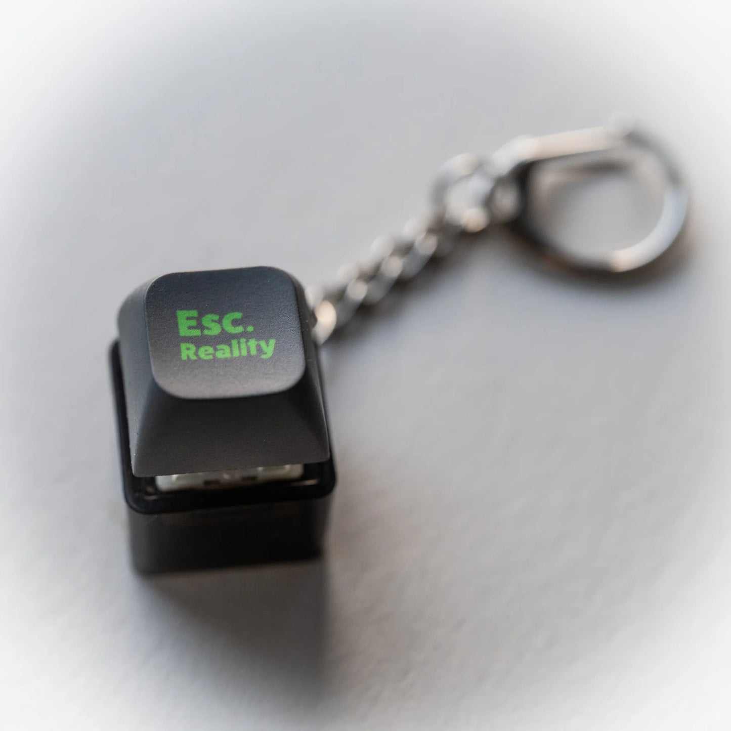 Escape Reality Clicky Keychain - pressable black keyboard-key fidget toy by PlayGay