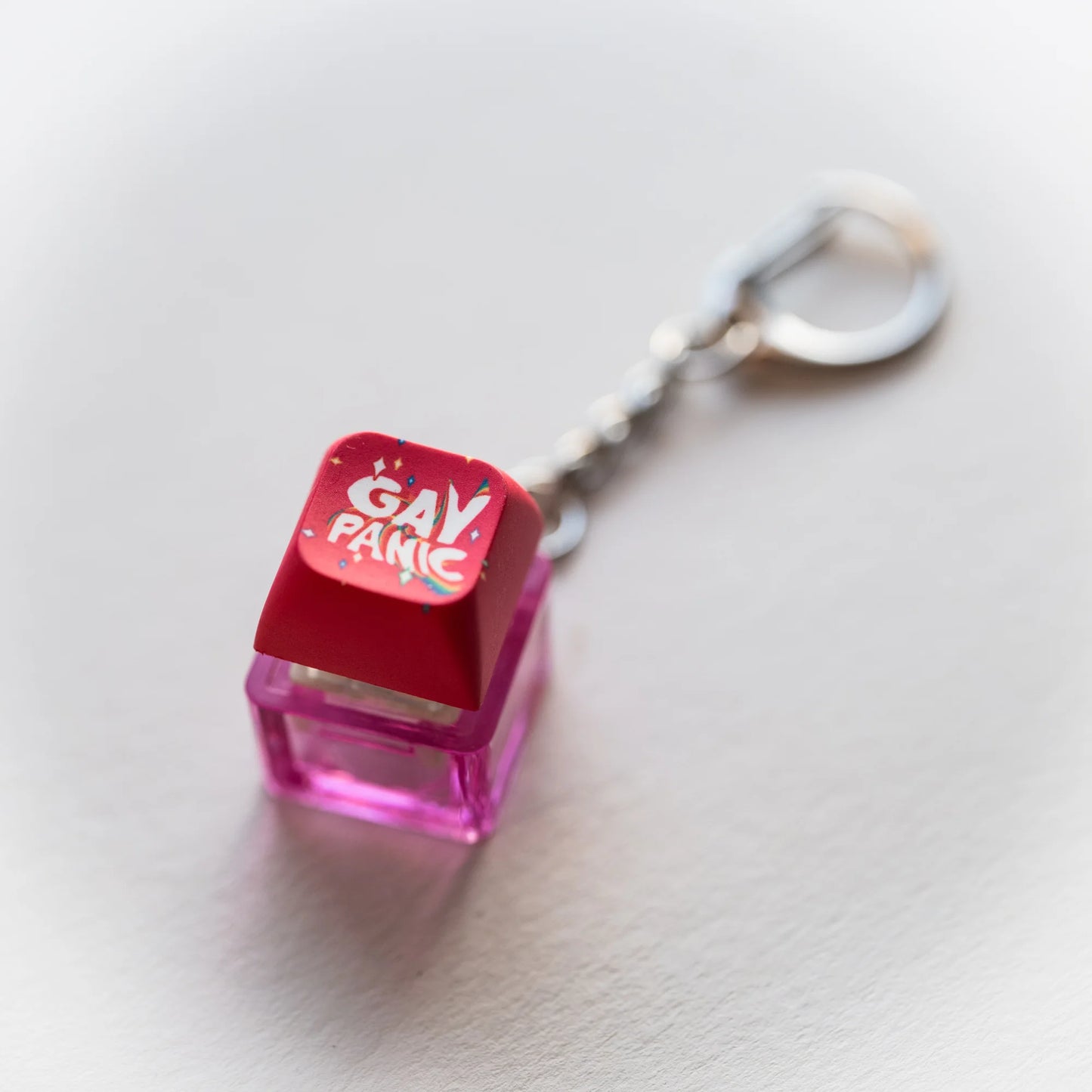 Gay Panic Clicky Keychain - pressable rainbow keyboard-key fidget toy by PlayGay