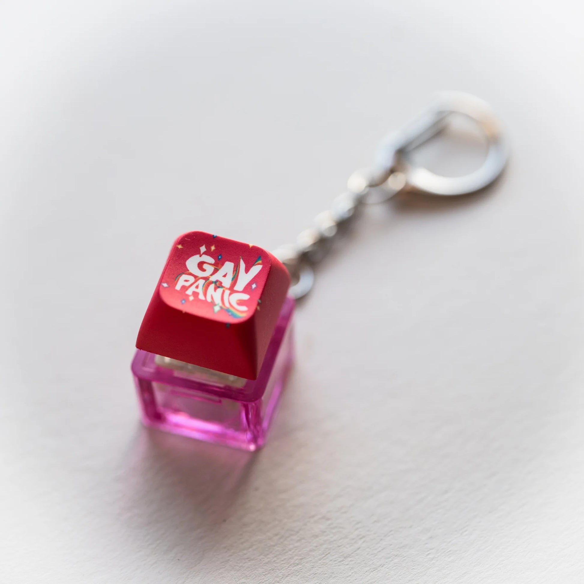 Gay Panic Clicky Keychain - pressable rainbow keyboard-key fidget toy by PlayGay