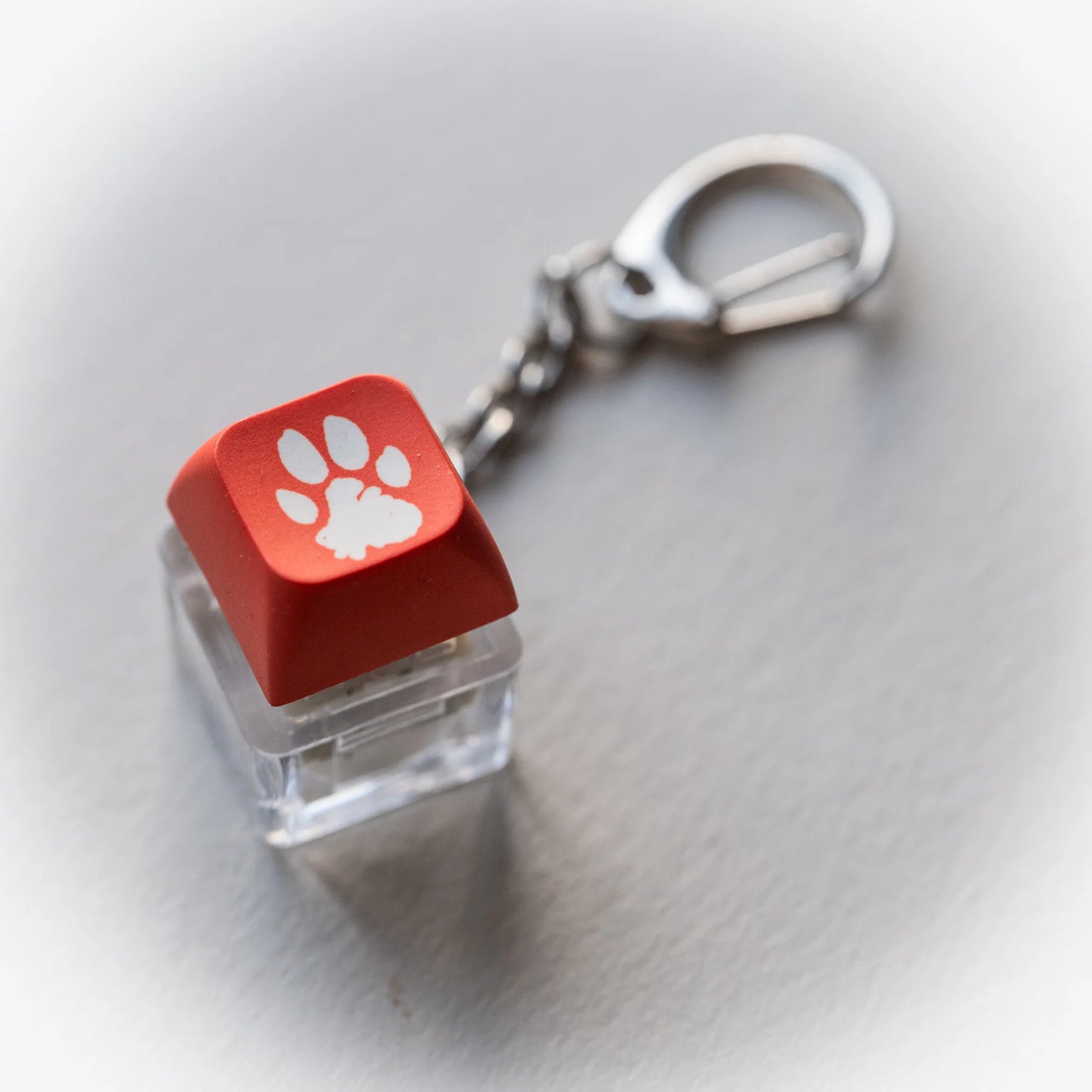 Orange Paw Clicky Keychain - pressable keyboard-key fidget toy with paw print by PlayGay