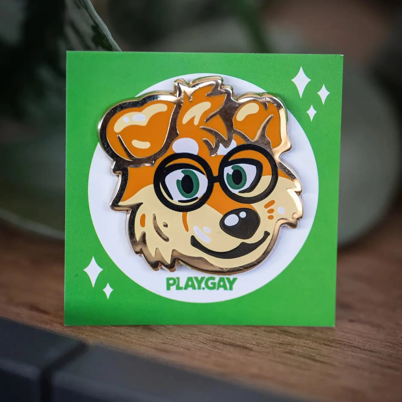 PlayGay x MaxFluffy Fluffy Dog Enamel Pin - gold enamel pin with nerdy golden retriever face wearing glasses on green backing card