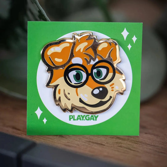 PlayGay x MaxFluffy Fluffy Dog Enamel Pin - gold enamel pin with nerdy golden retriever face wearing glasses on green backing card