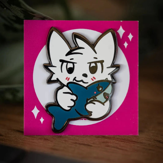 PlayGay Shark Kisser Enamel Pin – white Boykisser hugging a blue shark on pink backing card.
