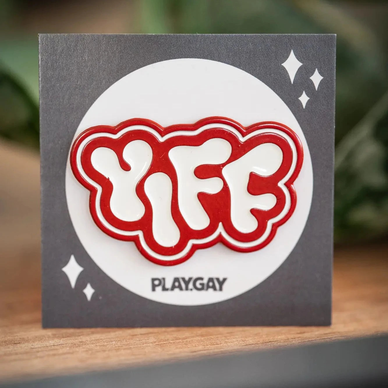 PlayGay Yiff Enamel Pin - bold red YIFF lettering in chrome hard enamel on grey backing card