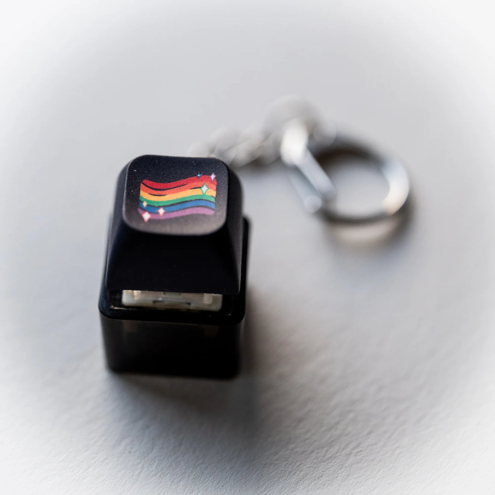 Black Rainbow Flag Clicky Keychain - pressable rainbow keyboard-key fidget toy by PlayGay