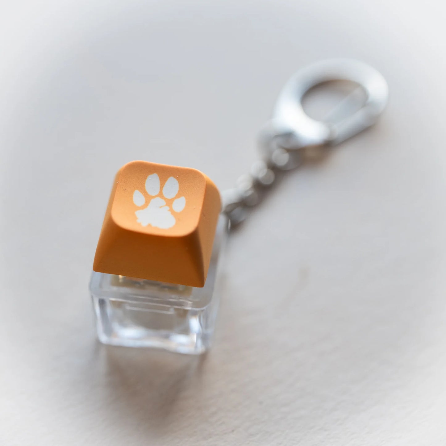 Yellow Paw Clicky Keychain - pressable keyboard-key fidget toy with paw print by PlayGay